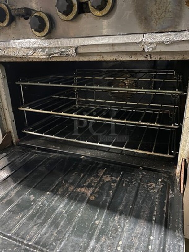 Garland Natural Gas Powered 10 Burner Stove! With 2 Full-Sized Convection Ovens! With Metal Oven Racks! With Raised Back Splash & Salamander Shelf! Stainless Steel! On Casters! WORKING WHEN REMOVED! - Image 6 of 11