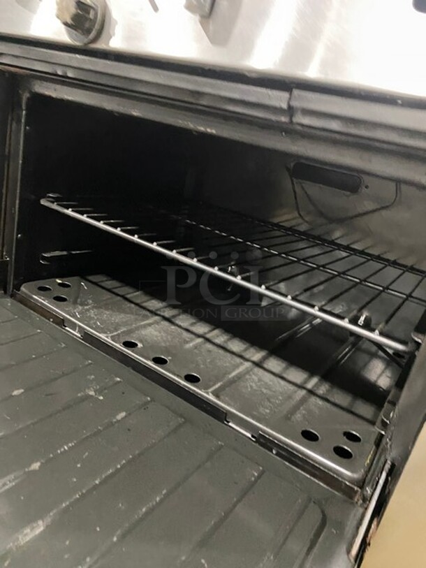 Garland Commercial Natural Gas Powered 12 Burner Stove! With 2 Full-Sized Ovens! With Metal Oven Racks! With Raised Back Splash & Salamander Shelf! Stainless Steel! On Casters! - Image 8 of 9
