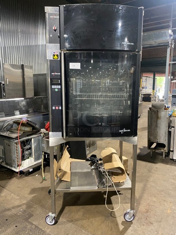 Amazing! RARE FIND! Alto-Shaam Commercial Chicken Rotisserie Oven! With 7 Spits! With Curved Glass! With Built In VENTLESS HOOD! Model AR-7EVH Serial 1953129000! 208V 3 Phase! On Stand With Casters! WORKING WHEN REMOVED! - Image 1 of 10