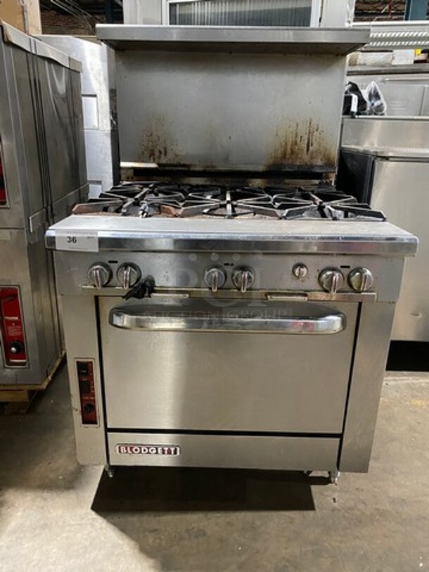 Blodgett Commercial Natural Gas Powered 6 Burner Stove! With Raised Back Splash And Salamander Shelf! With Oven Underneath! All Stainless Steel! On Legs! Model: B36DBBB SN: 08D64916