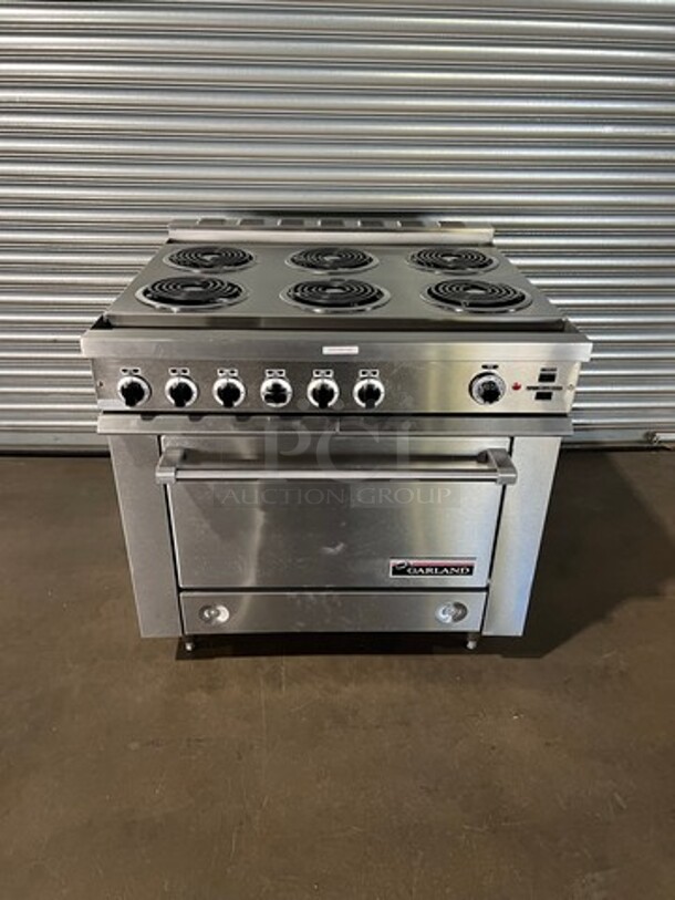 WOW! NEW OUT OF THE BOX! NEVER USED! Garland Heavy Duty Commercial Electric Powered 6 Burner Range With Full Size Convection Oven Underneath! All Stainless Steel Body! With Oven Racks! Model 36ER33