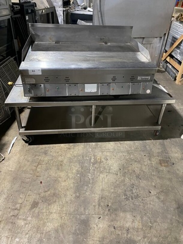 Garland Commercial Countertop Gas Powered Flat Griddle! With Back And Side Splashes! On Equipment Stand! With Storage Space Underneath! All Stainless Steel! On Casters!