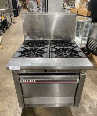 Garland Commercial Natural Gas Powered 4 Burner Stove! With Oven Underneath! With Raised Backsplash! All Stainless Steel! Model M44R 