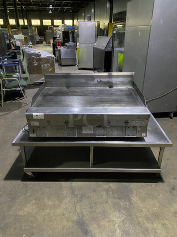 MUST HAVE! Garland Commercial Countertop Natural Gas Powered Heavy Duty Plancha Flat Grill! With Back And Side Splashes! On Heavy-Duty Stainless-Steel Equipment Stand! With Underneath Storage Space! On Casters!