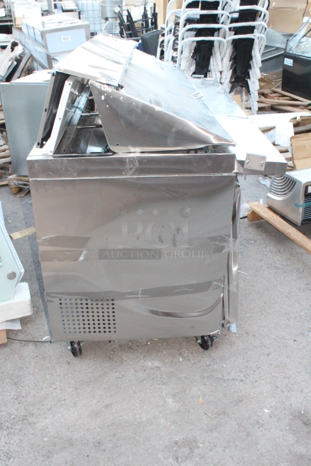 BRAND NEW SCRATCH & DENT! Avantco SS-PT-60M-HC 60" 2 Door Mega Top Stainless Steel Refrigerated Sandwich Prep Table. S/N: 130230645 60-1/4x35x45-7/8 Unit is dented and damaged. See photos. - Image 5 of 6