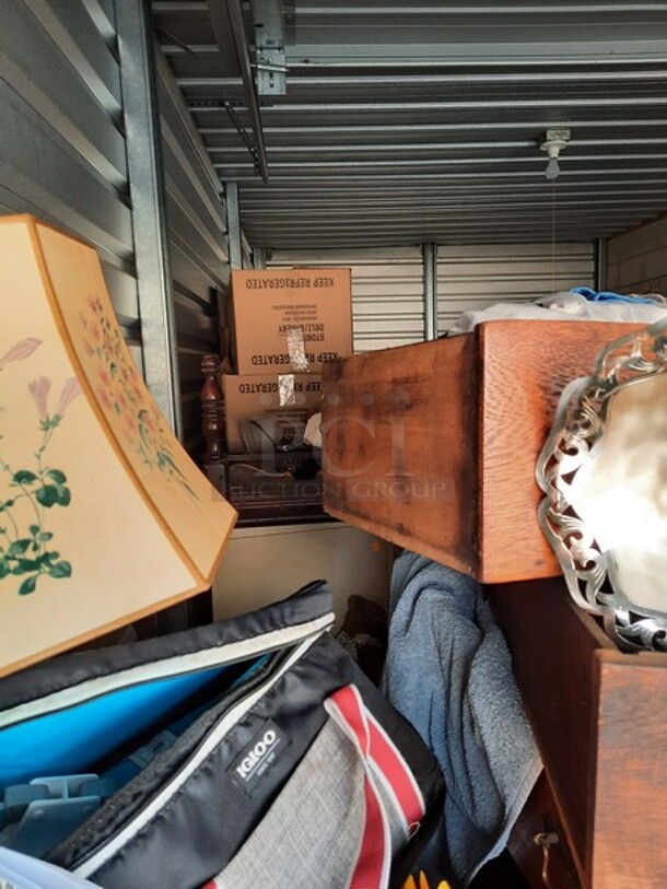 ALL ONE MONEY! Lot of Entire Contents of Storage Unit #29. Unit Size: 10 x 20. Unit Appears to Contain: Dressers, Bookshelves, Box Spring & Mattress, Wooden Bed, Couch, Chairs, Tables, Fan, Heaters, Bottle of Buttons, Longaberger Baskets, Lights, Mirror, Ironing Board, Rugs, Suitcases, Trashcan, Keurig, Blankets, Clothes, Shoes, Kerosene Heater, Large Stuffed Giraffe, Fake Plants, Bags, Totes & Boxes. Cleaning Deposit of $100 per Unit Paid on Pickup Day. Winner Has 7 Days From Close of Auction to Remove Items. All Items Must Be Removed and Unit Must Be Broom Swept to Get Cleaning Deposit Returned. Invoice and Cleaning Deposit Must Be Paid In Full by 4:00pm Tuesday, March 7th. Unit Must Be Cleared Out By 4:00pm Monday, March 13th. Please Come Into The Office To Settle Your Invoice and You Will Be Taken To Your Storage Unit for Cleanout. If You Plan To Clear Out Your Unit Saturday or Sunday You Need To Report To Our Office During The Week Before 4:00pm To Gain Access To Your Unit As Our Office Is Closed On Weekends. - Image 9 of 12