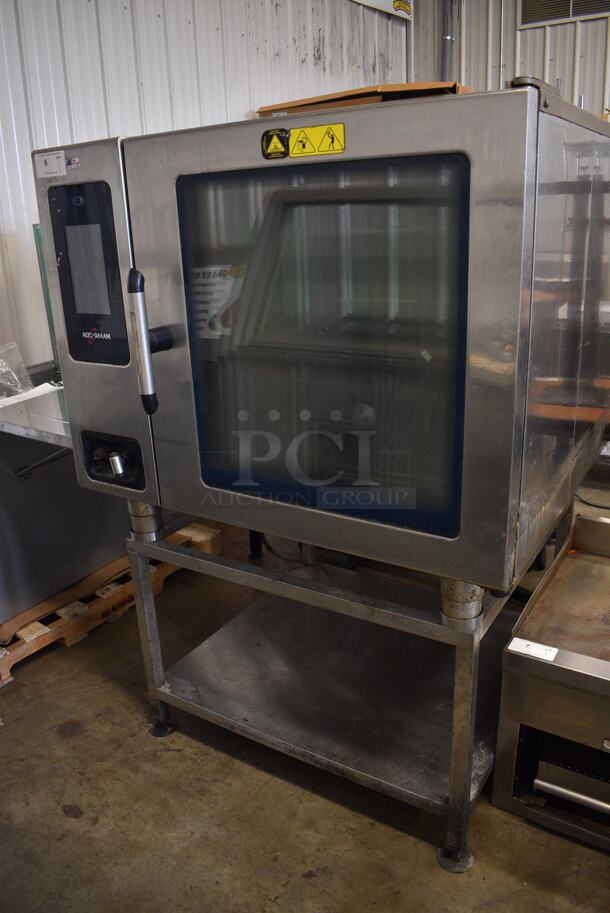2015 Alto Shaam Model CTP7-20E Stainless Steel Commercial Combitherm Convection Oven on Stainless Steel Commercial Equipment Stand. 208-240 Volts, 3 Phase. 44x40x64