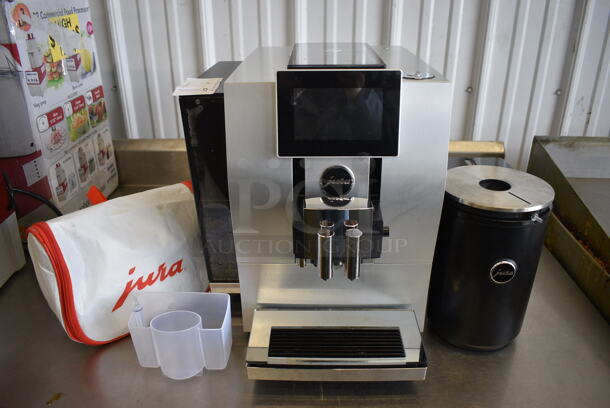 2019 Jura Z8 Type 729 Countertop Automatic Espresso Machine w/ Jura Cool Control Milk Container and Bag of Extra Pieces. Unit Was Used Approximately 20 Times Then Was Professionally Refurbished By Jura Within The Last Month. 120 Volts, 1 Phase. 13x18x15. Tested and Working!