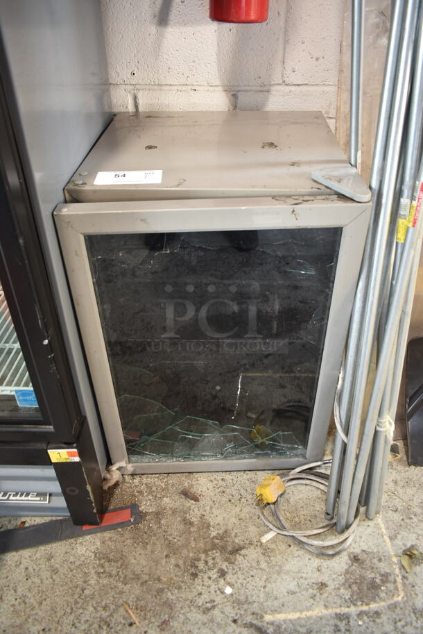 Frigidaire EFMIS9000 Metal Mini Cooler Merchandiser. See Pictures For Broken Glass Door Pane. 115 Volts, 1 Phase. Cannot Test Due To Cut Power Cord