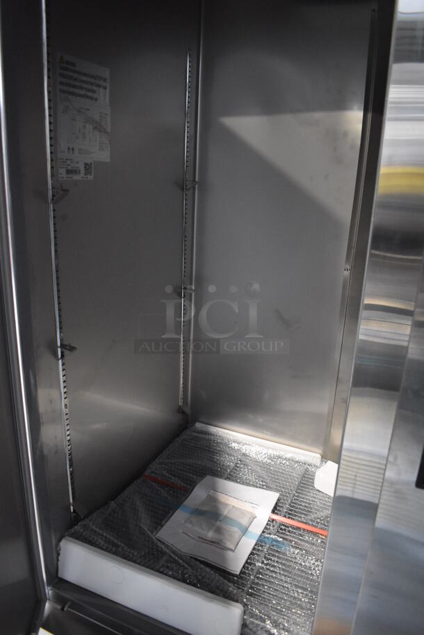 BRAND NEW SCRATCH AND DENT! KoolMore RIR-2D-SS Stainless Steel Commercial 2 Door Reach In Cooler w/ Poly Coated Racks on Commercial Casters. 115 Volts, 1 Phase. 54x32.5x83. Tested and Working! - Image 4 of 8