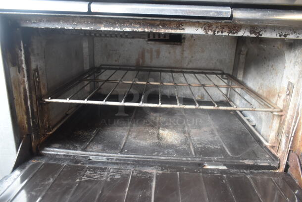 Garland SunFire Stainless Steel Commercial Natural Gas Powered 6 Burner Range w/ Oven and Back Splash on Commercial Casters.  - Image 6 of 8