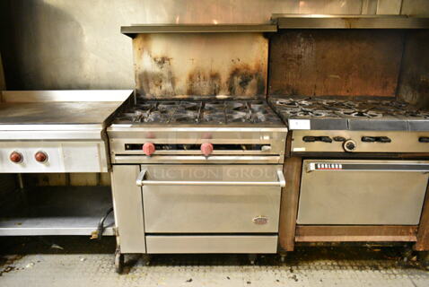 Dynamic Cooking Systems Stainless Steel Commercial Natural Gas Powered 6 Burner Range w/ Oven, Over Shelf and Back Splash. This Unit Was In Working Condition When the Restaurant Closed. (kitchen)