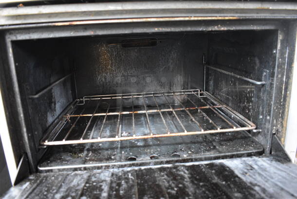Garland SunFire Stainless Steel Commercial Natural Gas Powered 6 Burner Range w/ Flat Top Griddle, 2 Ovens, Over Shelf and Back Splash on Commercial Casters. 60x33x60 - Image 8 of 11
