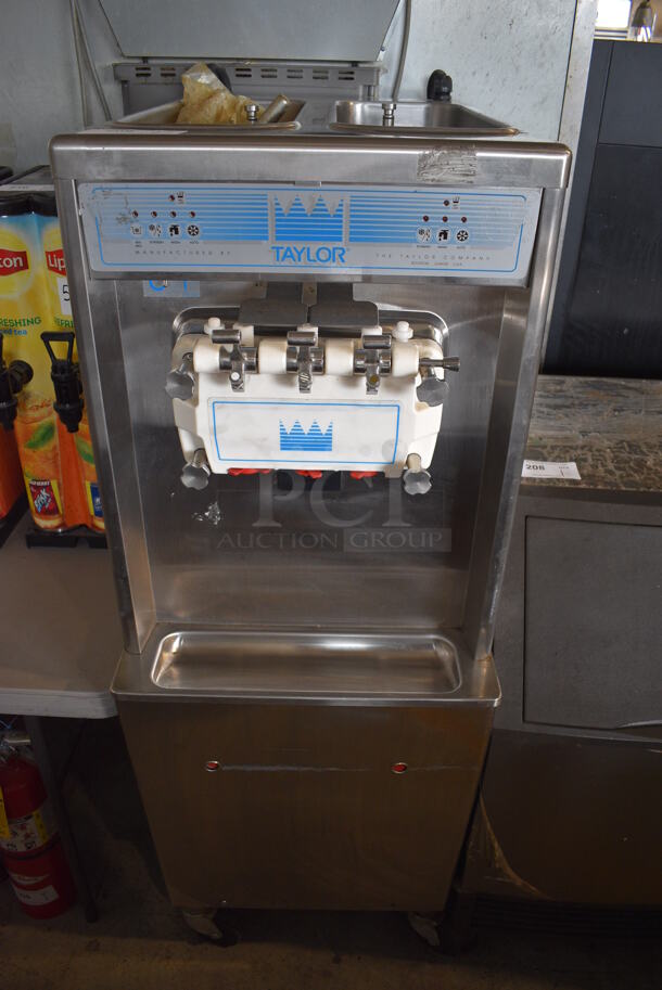 Taylor Model 794-33 Stainless Steel Commercial Water Cooled Floor Style 2 Flavor w/ Twist Soft Serve Ice Cream Machine on Commercial Casters. 208-230 Volts, 3 Phase. 20x34x59