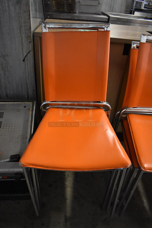 4 Dining Chairs w/ Orange Seat on Chrome Finish Frame. Stock Picture - Cosmetic  Condition May Vary.  18x18x35. 4 Times Your Bid!