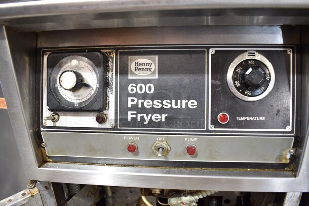 Henny Penny 600 Stainless Steel Commercial Floor Style Natural Gas Powered Pressure Fryer w/ Metal Fry Basket on Commercial Casters. 80,000 BTU.  - Image 5 of 10