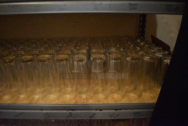 Gray Metal 5 Tier Shelving Unit w/ Contents Including Beverage Glasses and Wine Glasses. 48x24x72. BUYER MUST REMOVE; BUYER MUST DISMANTLE. PCI CANNOT DISMANTLE FOR SHIPPING. PLEASE CONSIDER FREIGHT CHARGES. (glass room - off of bar area) - Image 5 of 10