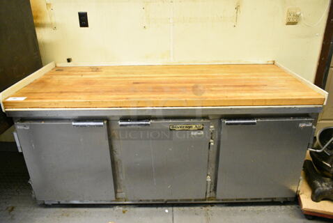 Beverage Air SUR72-15 Stainless Steel Commercial 3 Door Work Top Cooler w/ Butcher Block Countertop. 115 Volts, 1 Phase. This Unit Was In Working Condition When the Restaurant Closed. (kitchen)