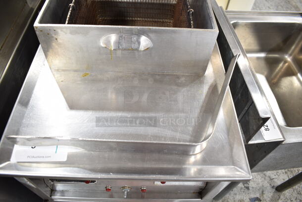 Henny Penny 600RB Stainless Steel Commercial Floor Style Natural Gas Powered Pressure Fryer w/ Metal Fry Basket on Commercial Casters. 80,000 BTU.  - Image 7 of 10