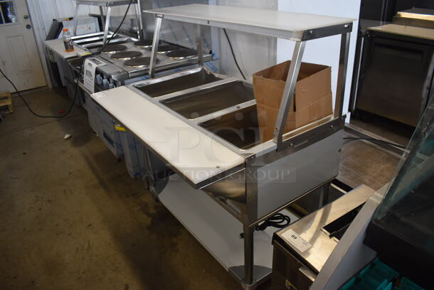 	BRAND NEW SCRATCH AND DENT! ServIt 423EST3WO Stainless Steel Commercial Electric Powered Three Pan Open Well Steam Table with Angled Sneeze Guard and Casters. 120 Volts, 1 Phase. - Image 3 of 10