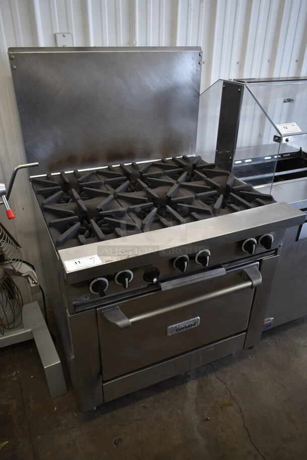 Garland G36-6R Stainless Steel Commercial Natural Gas Powered 6 Burner Range w/ Oven and Back Splash. - Image 1 of 8