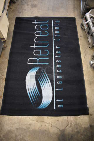Black Floor Rug w/ Retreat Logo. 67x44