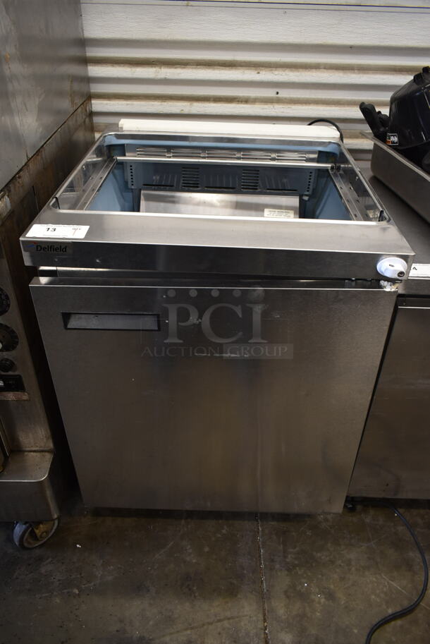 2014 Delfield 4427N-12M Stainless Steel Commercial Prep Table on Commercial Casters. 115 Volts, 1 Phase. Tested and Powers On But Does Not Get Cold
