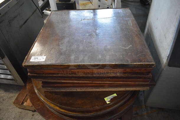 16 Various Wood Pattern Tabletops. 7 Round and 9 Square. Includes 33.5x33.5x1.5. 16 Times Your Bid!