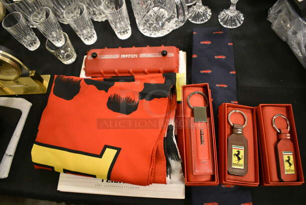 ALL ONE MONEY! Lot of Various Ferrari Items Including Keychains, Flag, Tie, and Accessory Book