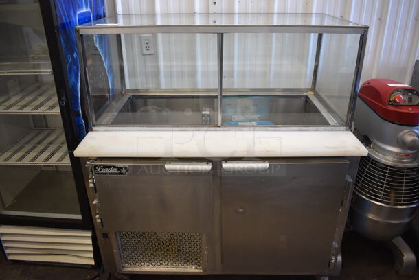 2014 Leader LM48 S/C Stainless Steel Commercial Prep Table w/ Glass Top Cabinet on Commercial Casters. 115 Volts, 1 Phase. 48x32x55. Cannot Test Due To Missing Power Cord