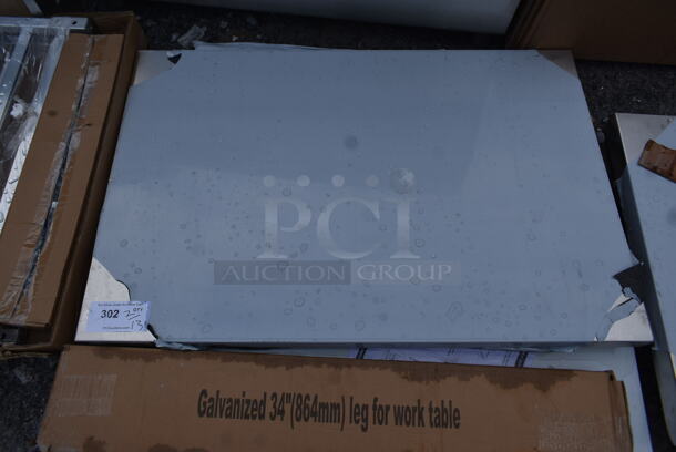 BRAND NEW SCRATCH AND DENT! Regency 600TSB3072S 30" x 72" 16-Gauge Stainless Steel Commercial Work Table with 4" Backsplash and Undershelf - Image 3 of 6