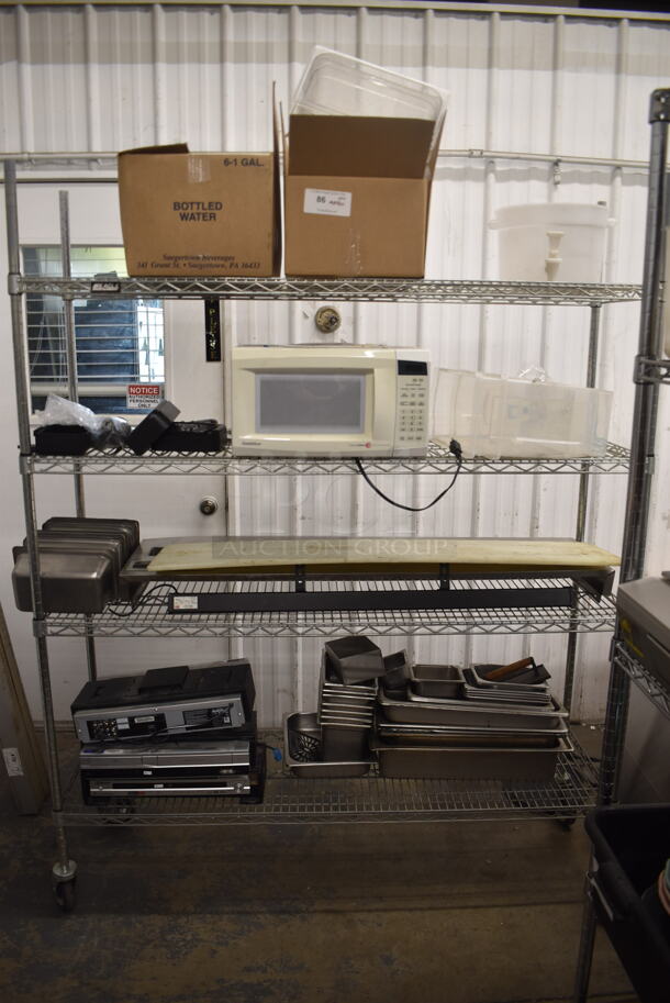 ALL ONE MONEY! Lot OF Items Gold Star Microwave, Framed Pictures, Small Plastic Cups, Storage Containers, Steel Drop In Bins, DVD Players/ 4HD Hi-Fi Stereos, AND MORE! Does Not Include Metro Shelf - Image 1 of 7