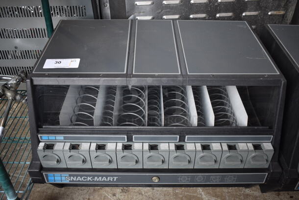 Snack-Mart Black Countertop 9 Slot Snack Vending Machine. 28x21x20.5 - Image 1 of 4