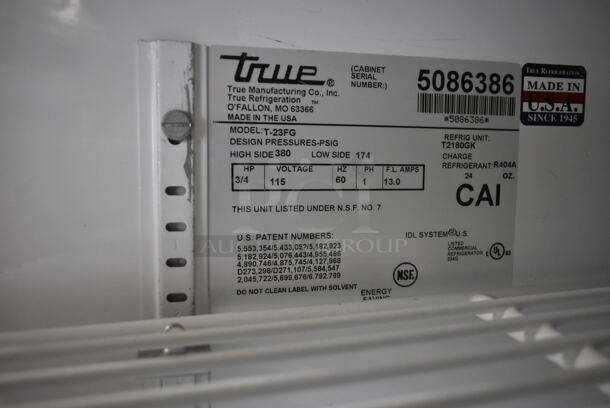 True T-23FG Stainless Steel Commercial Single Door Reach In Cooler Merchandiser w/ Poly Coated Racks on Commercial Casters. 115 Volts, 1 Phase. Tested and Powers On But Does Not Get Cold - Image 5 of 5