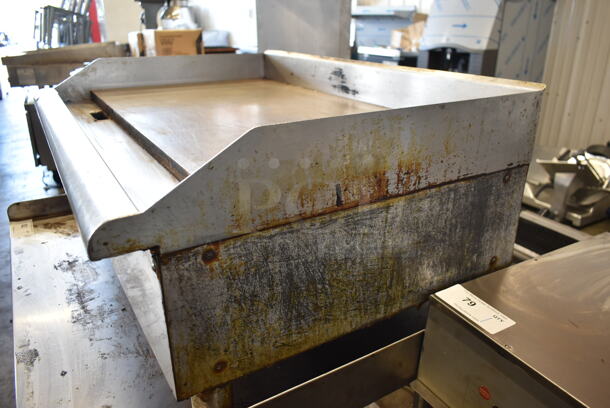 APW Wyott Stainless Steel Commercial Countertop Natural Gas Powered Flat Top Griddle.  - Image 6 of 7