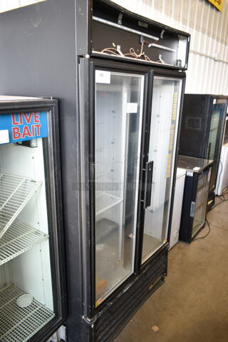2015 True GDM-35F-LD Metal Commercial 2 Door Reach In Freezer Merchandiser w/ Poly Coated Racks. 115 Volts, 1 Phase. Tested and Powers On But Does Not Get Cold