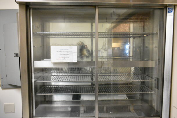 Delfield Stainless Steel Commercial Refrigerated Prep Table w/ 2 Lower Doors. BUYER MUST REMOVE: Bring Tools and Manpower Needed To Remove This Item. This Unit Was In Working Condition When the Restaurant Closed. (kitchen entryway) - Image 5 of 7