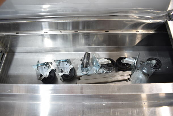 BRAND NEW SCRATCH AND DENT! 2023 Avantco 178APPT91HC Stainless Steel Commercial Pizza Prep Table. Comes w/ Commercial Casters. 115 Volts, 1 Phase. Tested and Does Not Power On - Image 5 of 9
