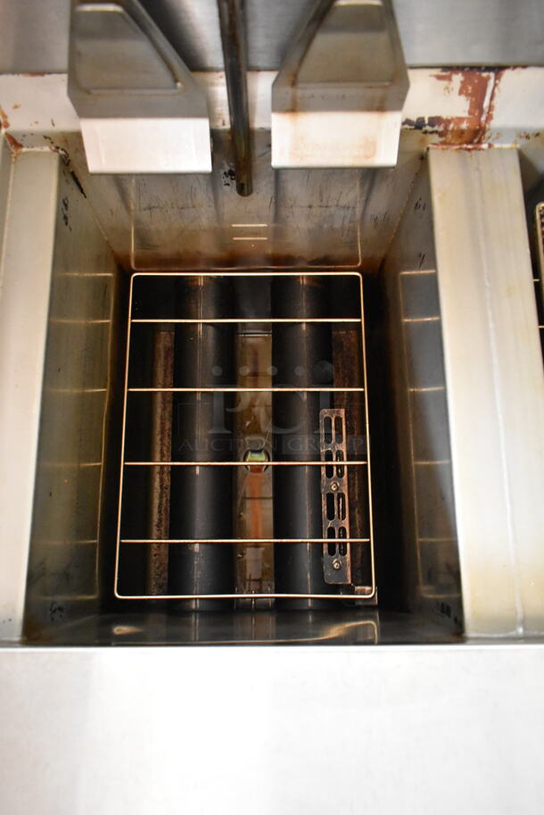 2016 Henny Penny OGA-323 ENERGY STAR Stainless Steel Commercial Natural Gas Powered 3 Bay Fryer w/ 4 Metal Fry Baskets on Commercial Casters. 255,000 BTU.  - Image 8 of 12