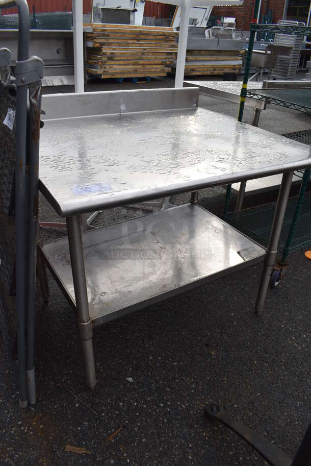 Stainless Steel Table w/ Back Splash and Under Shelf. 42x36x40