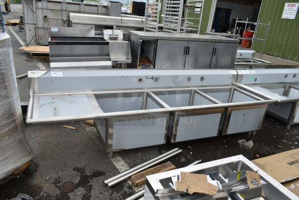 BRAND NEW SCRATCH AND DENT! Regency 600S3242424L Stainless Steel Commercial 3 Bay Sink w/ Left Side Drain Board. No Legs. Bays 24x14.  - Image 1 of 7
