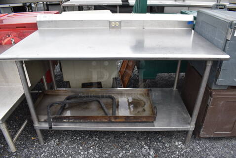 Stainless Steel Table w/ Back Splash and Metal Under Shelf. 60x31x41