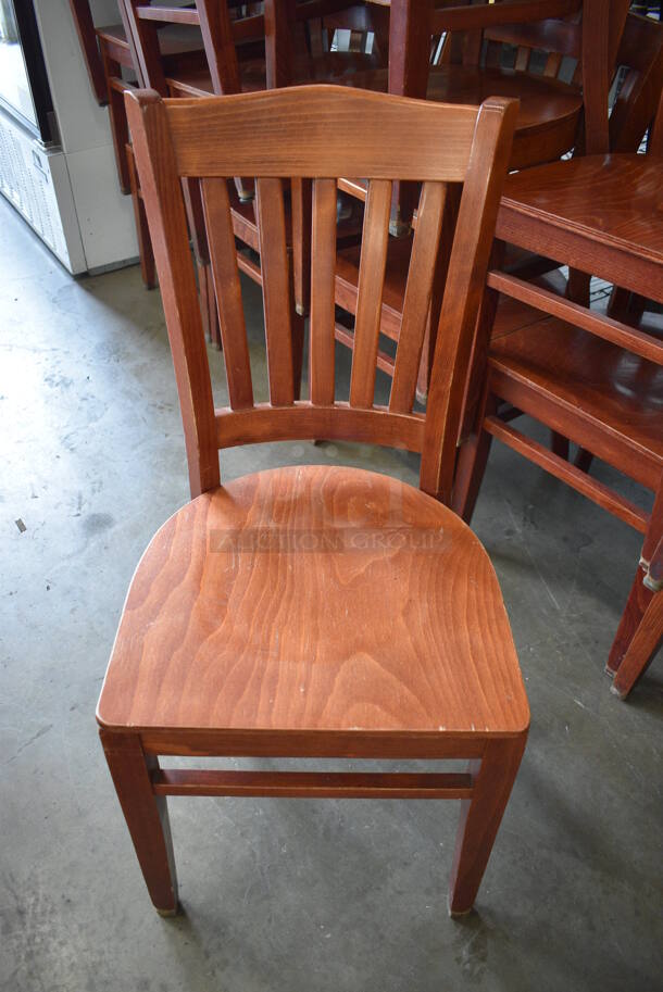 4 Wood Pattern Chairs w/ Vertical Back Rest Bars. Stock Picture - Cosmetic Condition May Vary. 17x17x35. 4 Times Your Bid!