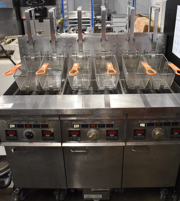 Keating Model 14TFMRI Stainless Steel Commercial Floor Style Natural Gas Powered 3 Bay Instant Recovery Deep Fat Fryer w/ Filtration System and 6 Metal Fry Baskets on Commercial Casters. 46x31.5x55