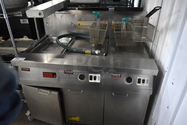 Frymaster FM245ESC Stainless Steel Commercial Natural Gas Powered 2 Burner Deep Fat Fryer w/ Dumping Station and 3 Metal Fry Baskets on Commercial Casters. 122,000 BTU. 
