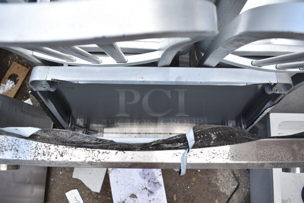 BRAND NEW SCRATCH AND DENT! Regency 600TSB2430S 24" x 30" 16-Gauge Stainless Steel Commercial Work Table with 4" Backsplash and Undershelf. No Legs.   - Image 5 of 6