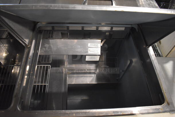 Delfield 4472N-3DM Commercial Stainless Steel Three Door Sandwich/Salad Prep Refrigerator Station on Commercial Casters. 115V/1 Phase. Can't Test Due To Cut Cord - Image 5 of 9