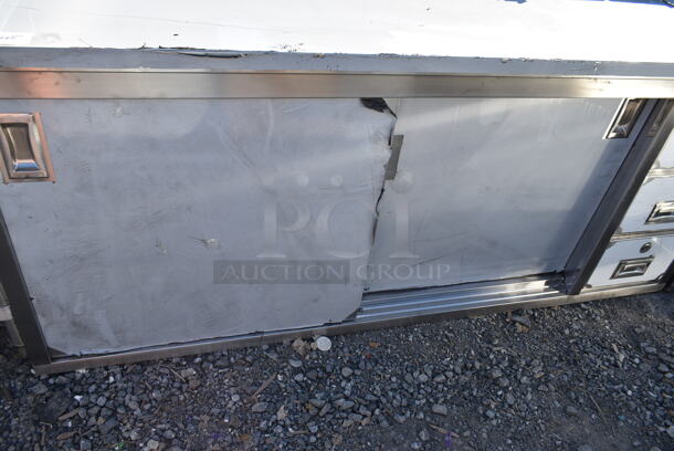 BRAND NEW SCRATCH AND DENT! Regency 600EBTB3072R 30" x 72" 16 Gauge Type 304 Stainless Steel Enclosed Base Sliding Door Table with Drawers and 6" Backsplash - Image 3 of 8