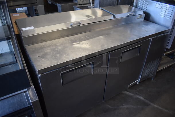 True TPP-67 Stainless Steel Commercial Pizza Prep Table on Commercial Casters. 115 Volts, 1 Phase. 67x32x42. Tested and Powers On But Temps at 49 Degrees