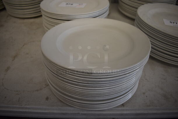 23 White Ceramic Plates. 10.5x10.5x1. 23 Times Your Bid!